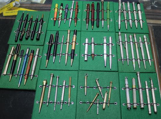 A collection of vintage propelling pencils in a tin case (57)